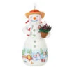 Hallmark Snowtop Lodge Terran S. Gardner Porcelain Ornament 1 Hallmark Snowtop Lodge Terran S. Gardner Porcelain Ornament -Hallmark Snowman with Flower Pot Keepsake Ornament 2299QXR8119 01
